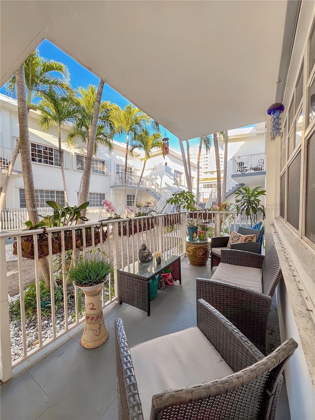 view of patio featuring a balcony