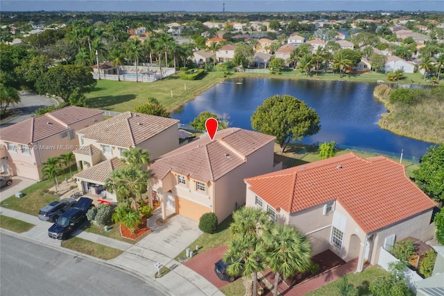 bird's eye view with a water view and a residential view