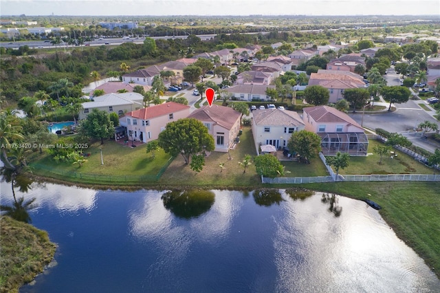 drone / aerial view featuring a water view and a residential view