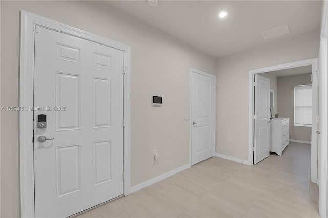 interior space featuring baseboards