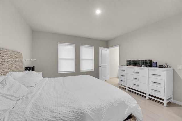 bedroom featuring baseboards