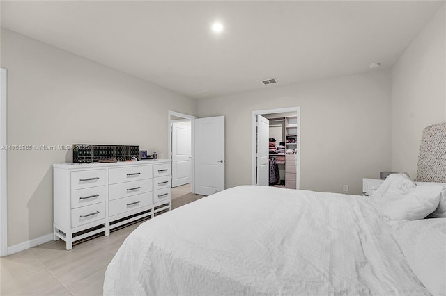 3705 Bennington Ln, Fort Pierce, FL 34981 - bedroom featuring a spacious closet, baseboards, a closet, and light tile patterned floors