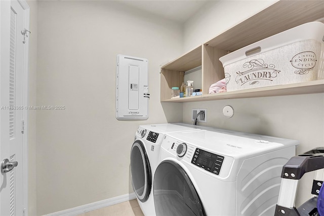 laundry room with light tile patterned floors, laundry area, separate washer and dryer, and baseboards