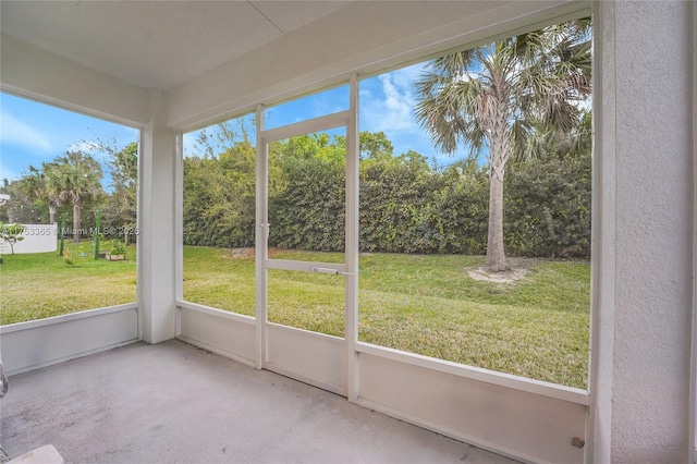 3705 Bennington Ln, Fort Pierce, FL 34981 - unfurnished sunroom with view of wooded area