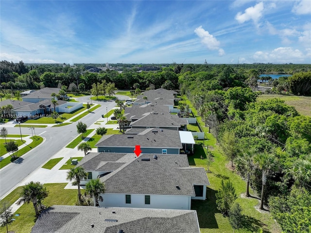 aerial view with a water view and a residential view