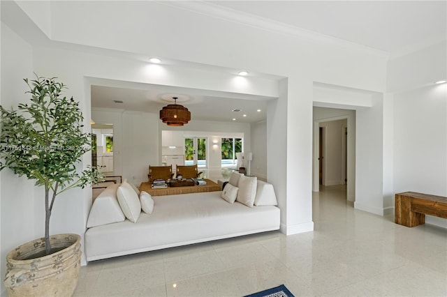 bedroom featuring crown molding, baseboards, and granite finish floor