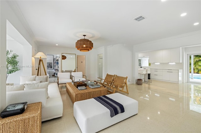 living room featuring baseboards, ornamental molding, visible vents, and recessed lighting