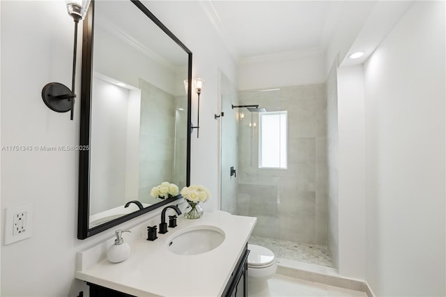 full bathroom featuring vanity, ornamental molding, a shower stall, and toilet