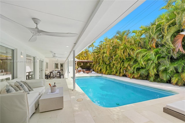 pool featuring a ceiling fan, an outdoor living space, a patio, and french doors