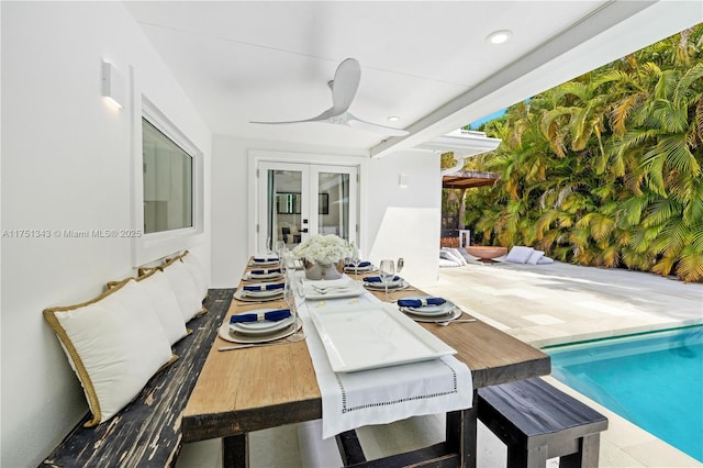 interior space featuring ceiling fan, french doors, and an outdoor pool