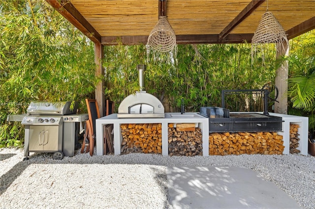 view of patio / terrace with area for grilling and a grill