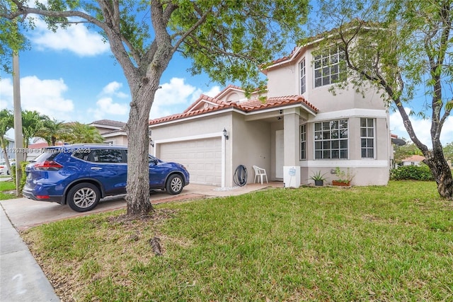 view of front of house featuring driveway, stucco siding, a tiled roof, an attached garage, and a front yard