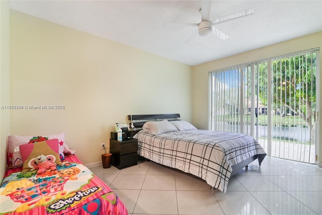 bedroom featuring light tile patterned floors, access to outside, baseboards, and ceiling fan