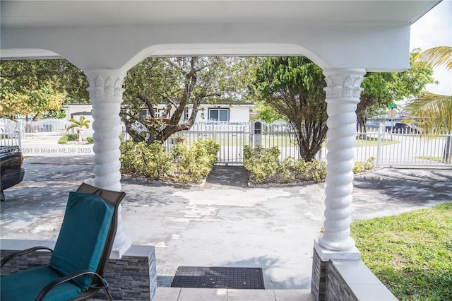 view of patio / terrace featuring a gate and fence