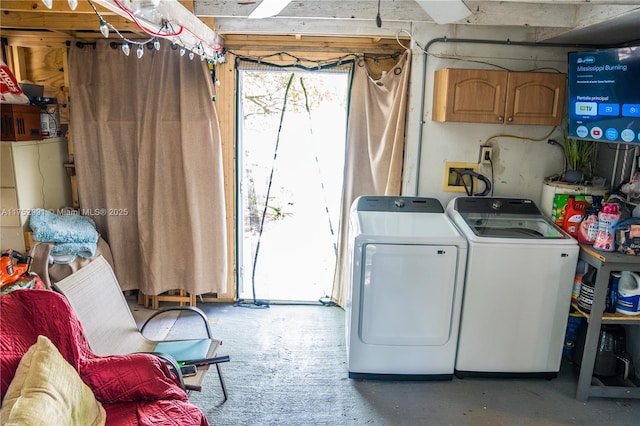 washroom featuring laundry area and washer and clothes dryer