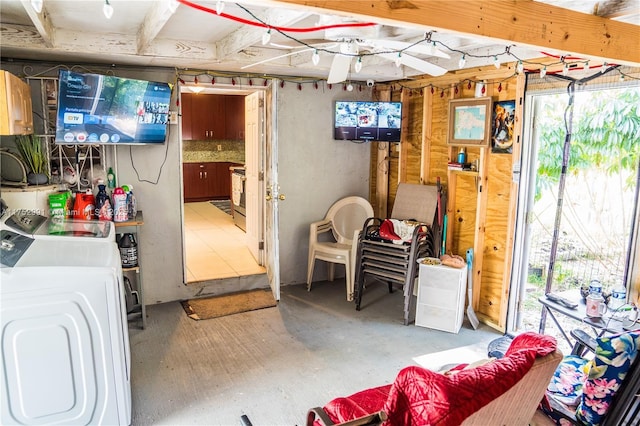 basement with a healthy amount of sunlight and independent washer and dryer