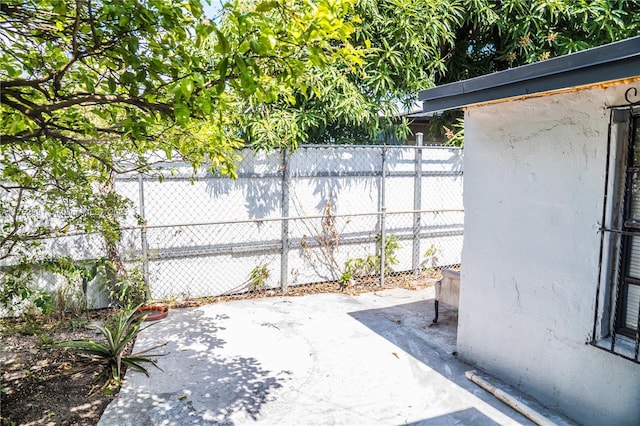 view of patio / terrace featuring fence