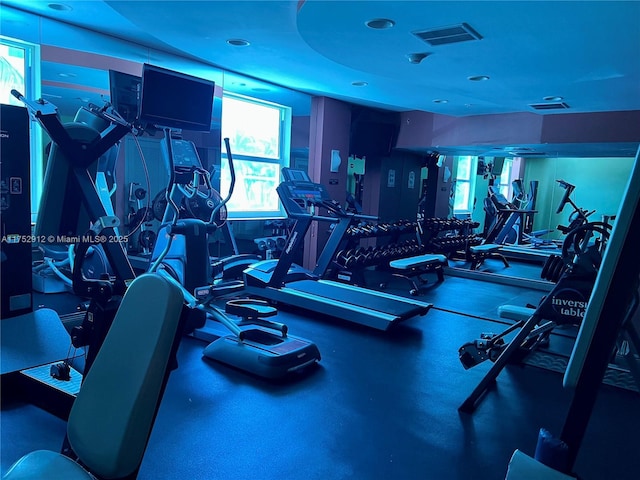 exercise room featuring visible vents