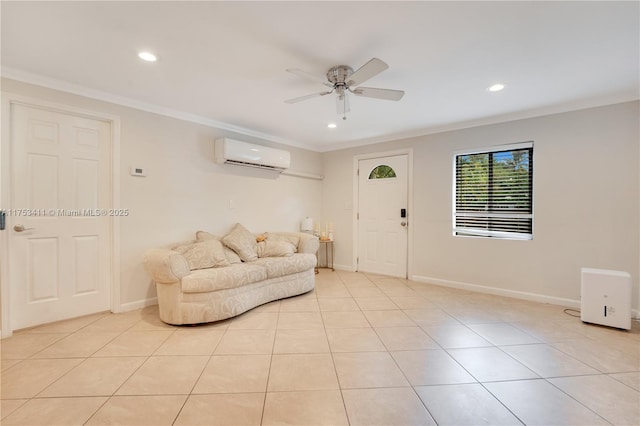 living area featuring baseboards, ceiling fan, ornamental molding, an AC wall unit, and light tile patterned flooring