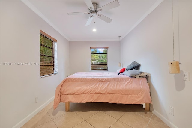 bedroom featuring a ceiling fan, crown molding, baseboards, and light tile patterned floors