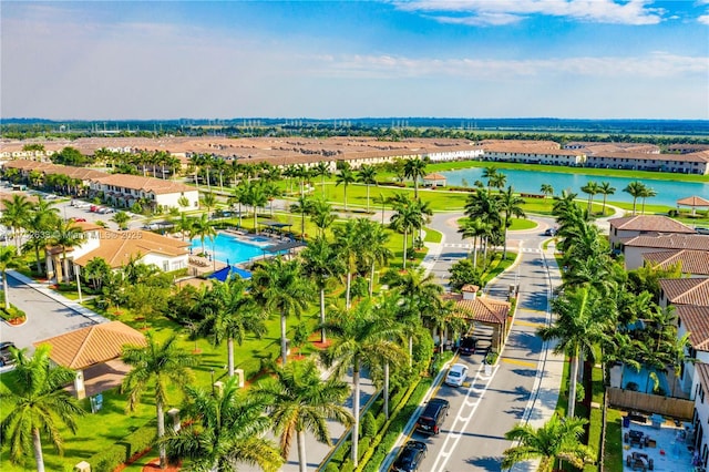 bird's eye view with a water view and a residential view