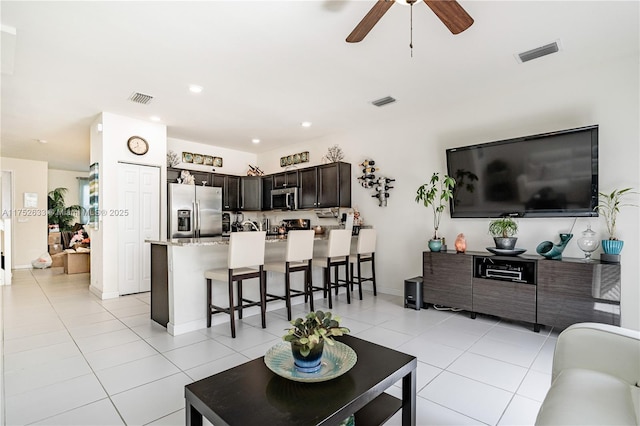 living room featuring recessed lighting, visible vents, ceiling fan, and light tile patterned flooring