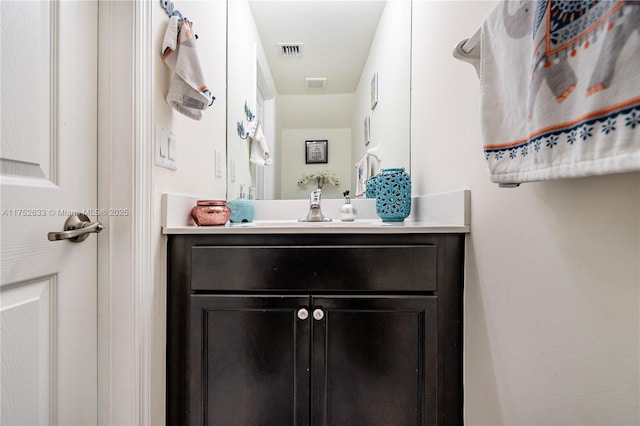 bathroom featuring vanity and visible vents