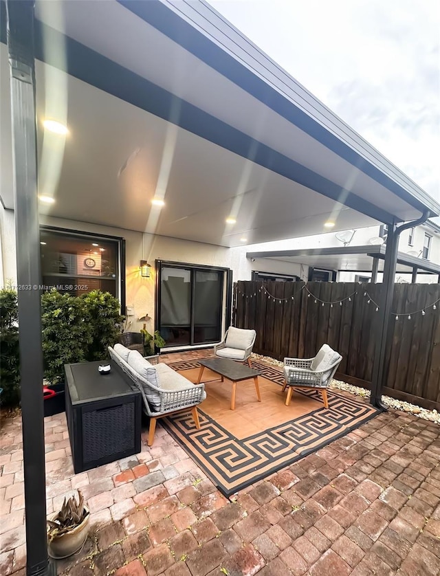 view of patio featuring fence