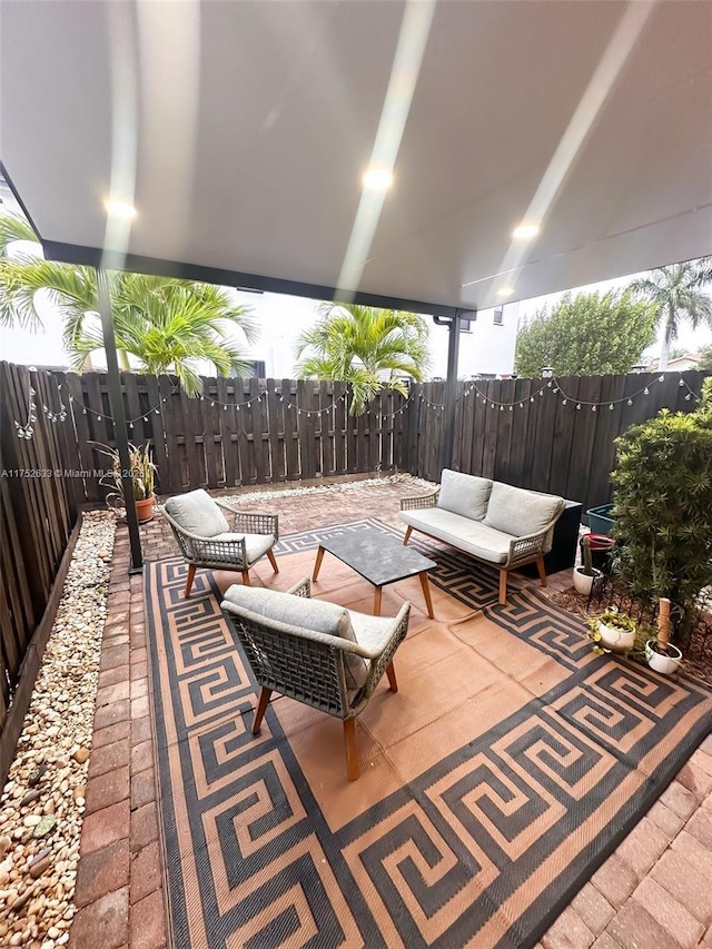 view of patio / terrace featuring fence and an outdoor hangout area