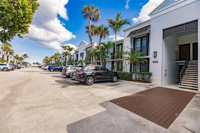 1698 S Ocean Ln Unit 171, Fort Lauderdale, FL 33316 - uncovered parking lot featuring stairs and a residential view
