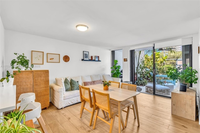 dining room with light wood-style flooring