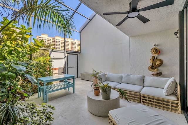 view of patio featuring a ceiling fan, a lanai, a balcony, and an outdoor hangout area