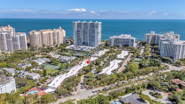 drone / aerial view featuring a water view and a view of city