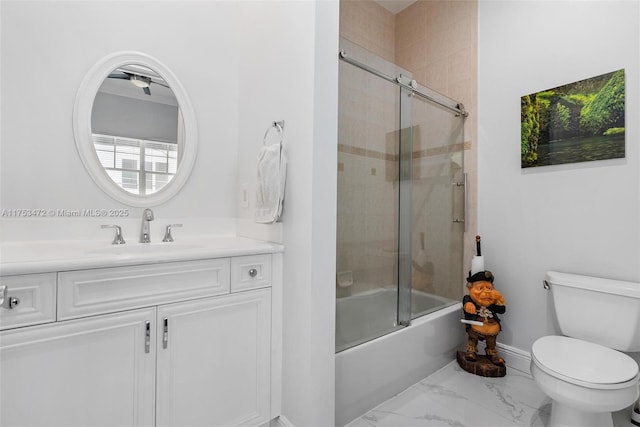 180 NE 6th Ave Unit E, Delray Beach, FL 33483 - bathroom with toilet, vanity, marble finish floor, and plenty of natural light