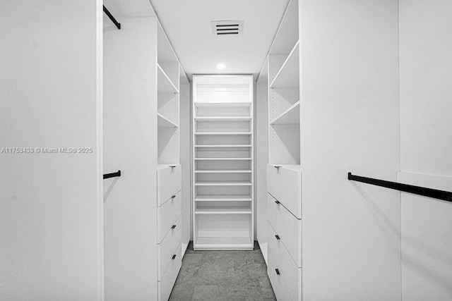 walk in closet with visible vents