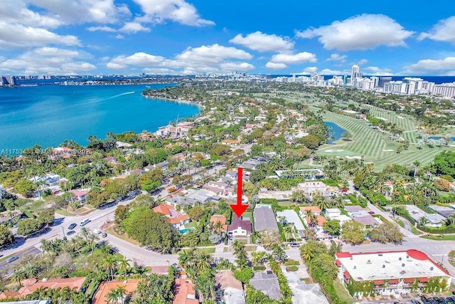 drone / aerial view featuring a view of city and a water view