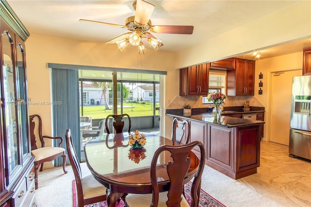 dining room with a ceiling fan