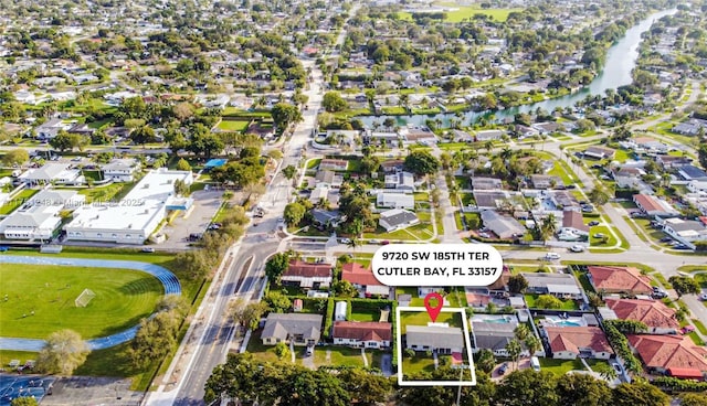 bird's eye view featuring a residential view and a water view