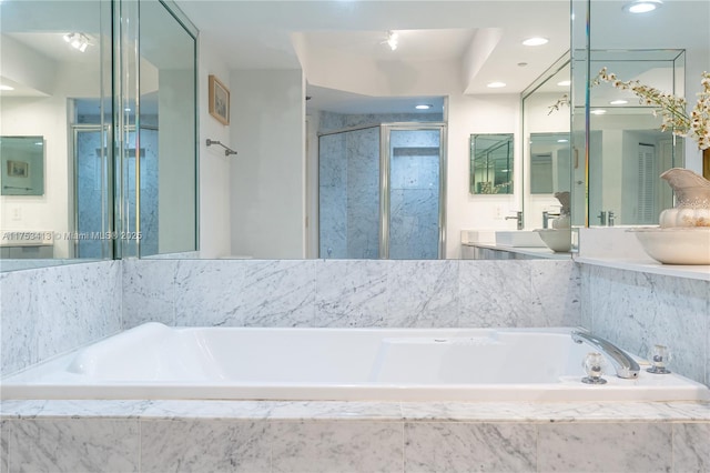 full bathroom with recessed lighting, a shower stall, vanity, and a bath