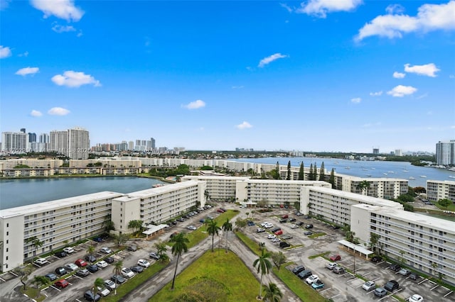 bird's eye view featuring a water view and a city view