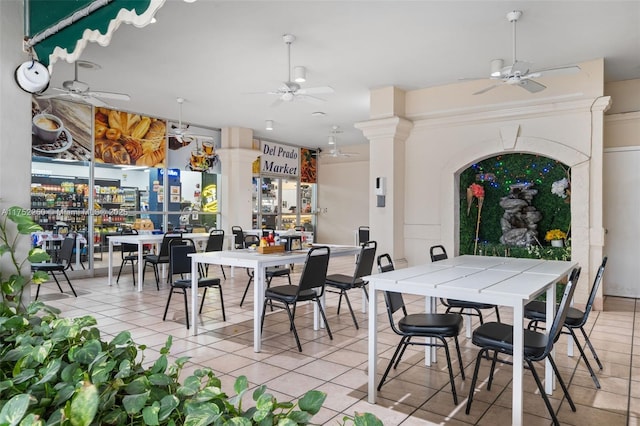 dining area featuring a ceiling fan and light tile patterned flooring