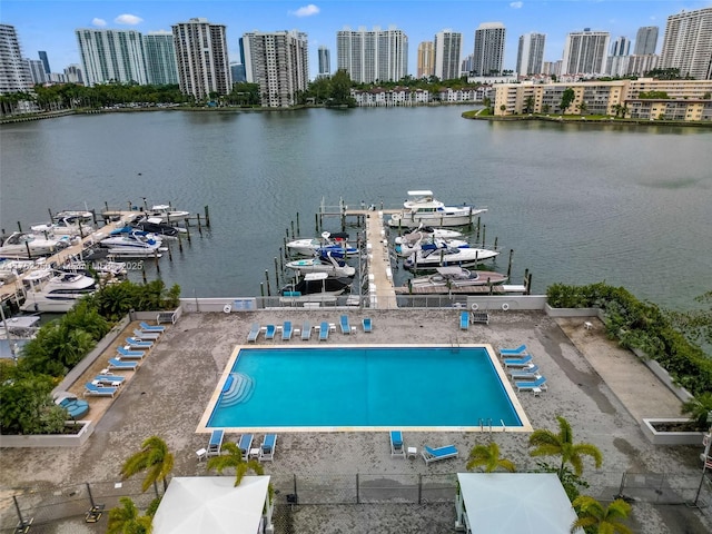 birds eye view of property featuring a water view and a city view