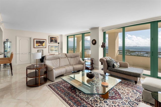 living room with marble finish floor, baseboards, and a wall of windows