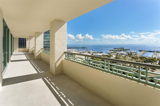 balcony featuring a water view