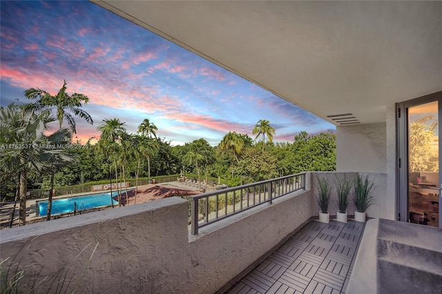 view of balcony at dusk