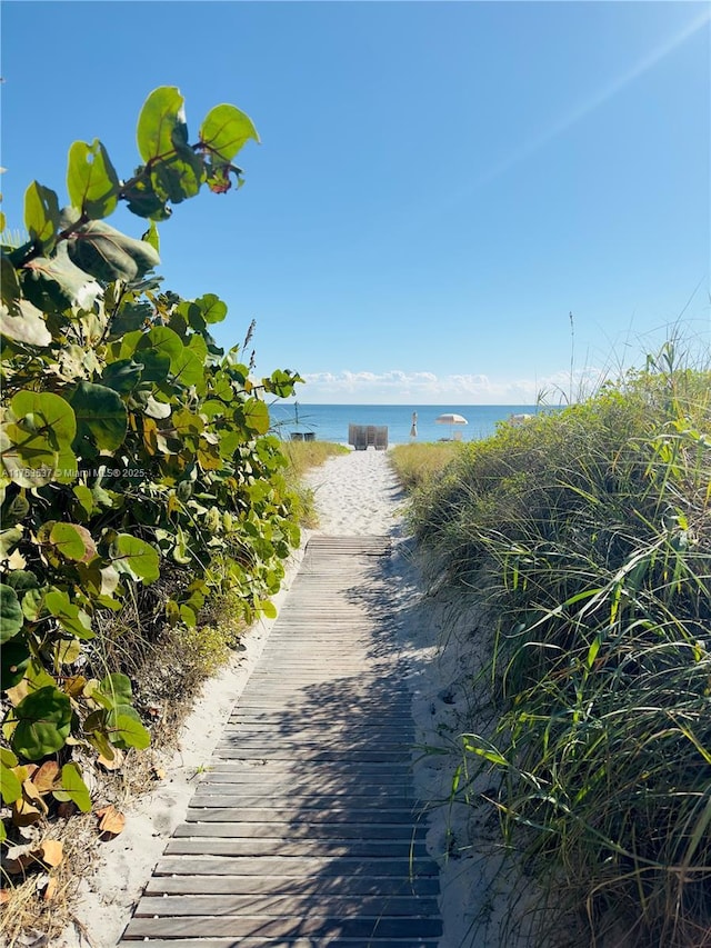 property view of water featuring a beach view