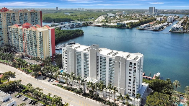 birds eye view of property featuring a view of city and a water view