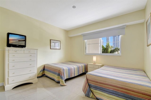 bedroom with light tile patterned flooring