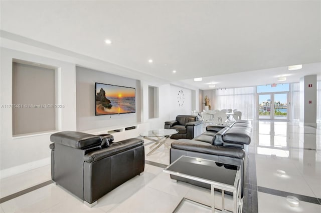 living room with baseboards and recessed lighting