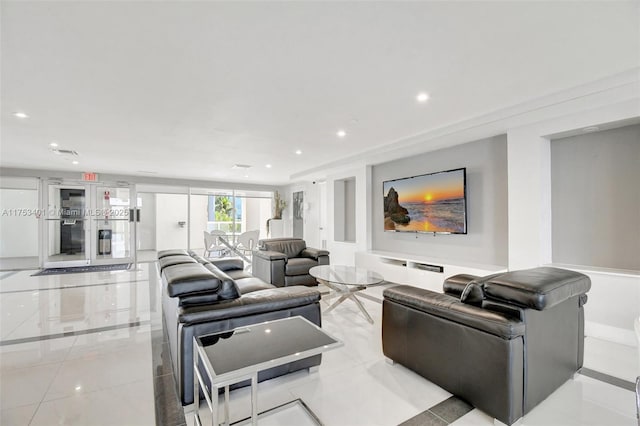 living area with light tile patterned flooring, visible vents, and recessed lighting